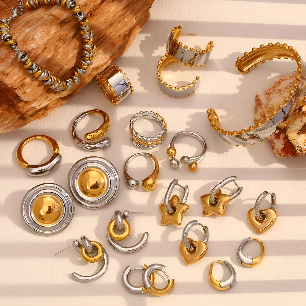 Gold electroplated women's jewellery set with geometric earrings, bracelet, and necklace on stainless steel