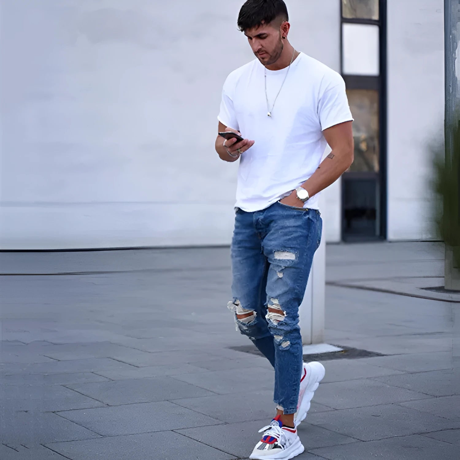 Men's deep blue jeans with knee hole distressed detailing on cotton fabric