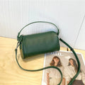 Soft genuine leather cylindrical crossbody bag in street style, shown in black, with a single strap.