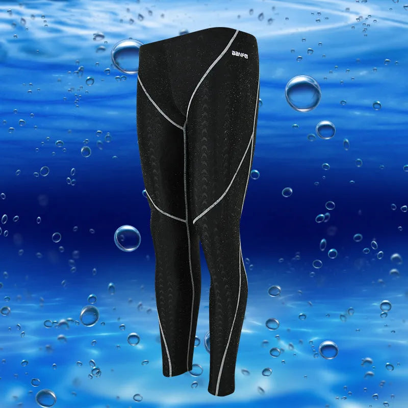 Men's nylon cropped swimming trunks in black with contrast line pattern for athletic swimming and fitness