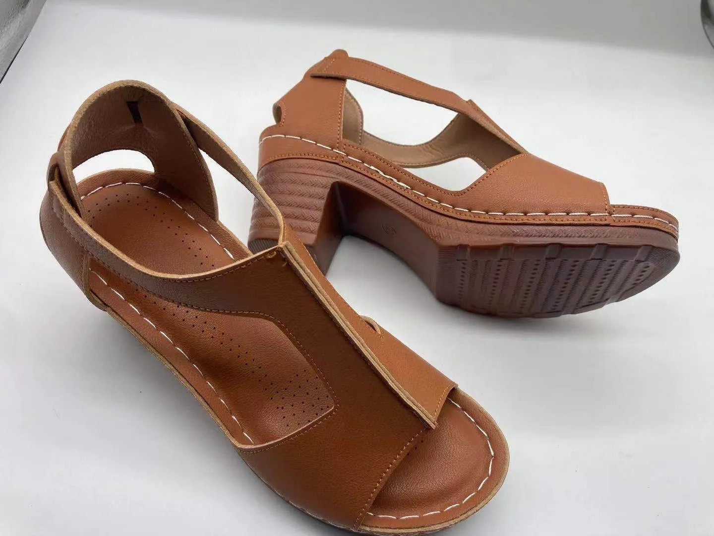 Women's white peep toe wedge sandals with Roman style buckle and low heel
