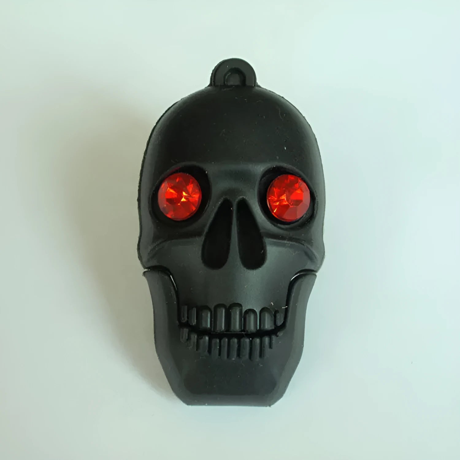 Halloween skeleton skull design USB flash drive with a small metal attachment chain.