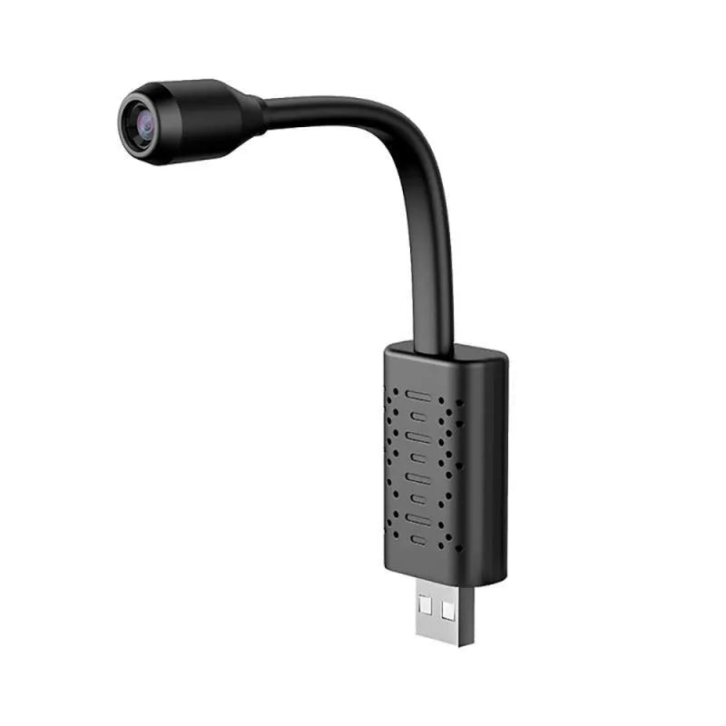 Black V380 wireless USB security camera on a table next to a mobile power bank.