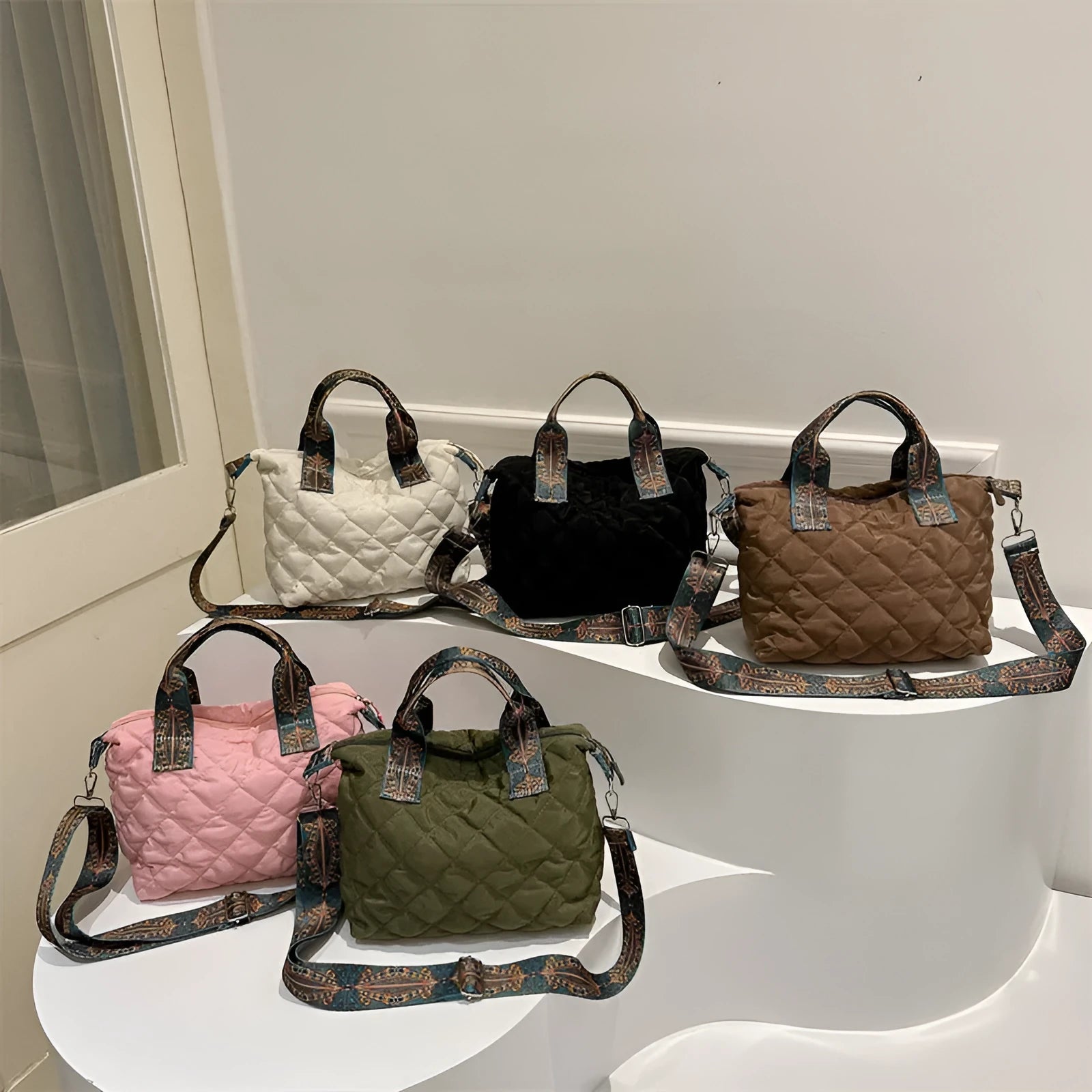 Soft horizontal square Oxford cloth shoulder messenger bag in green with embroidery detail and a single strap.