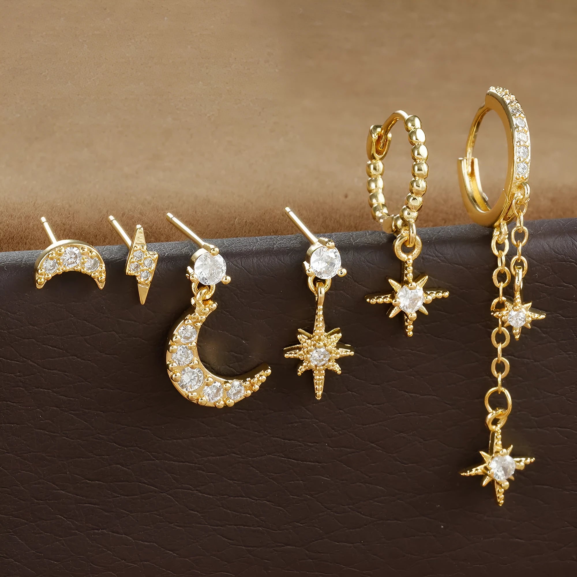 Six gold electroplated chain tassel earrings with zircon studs on copper base