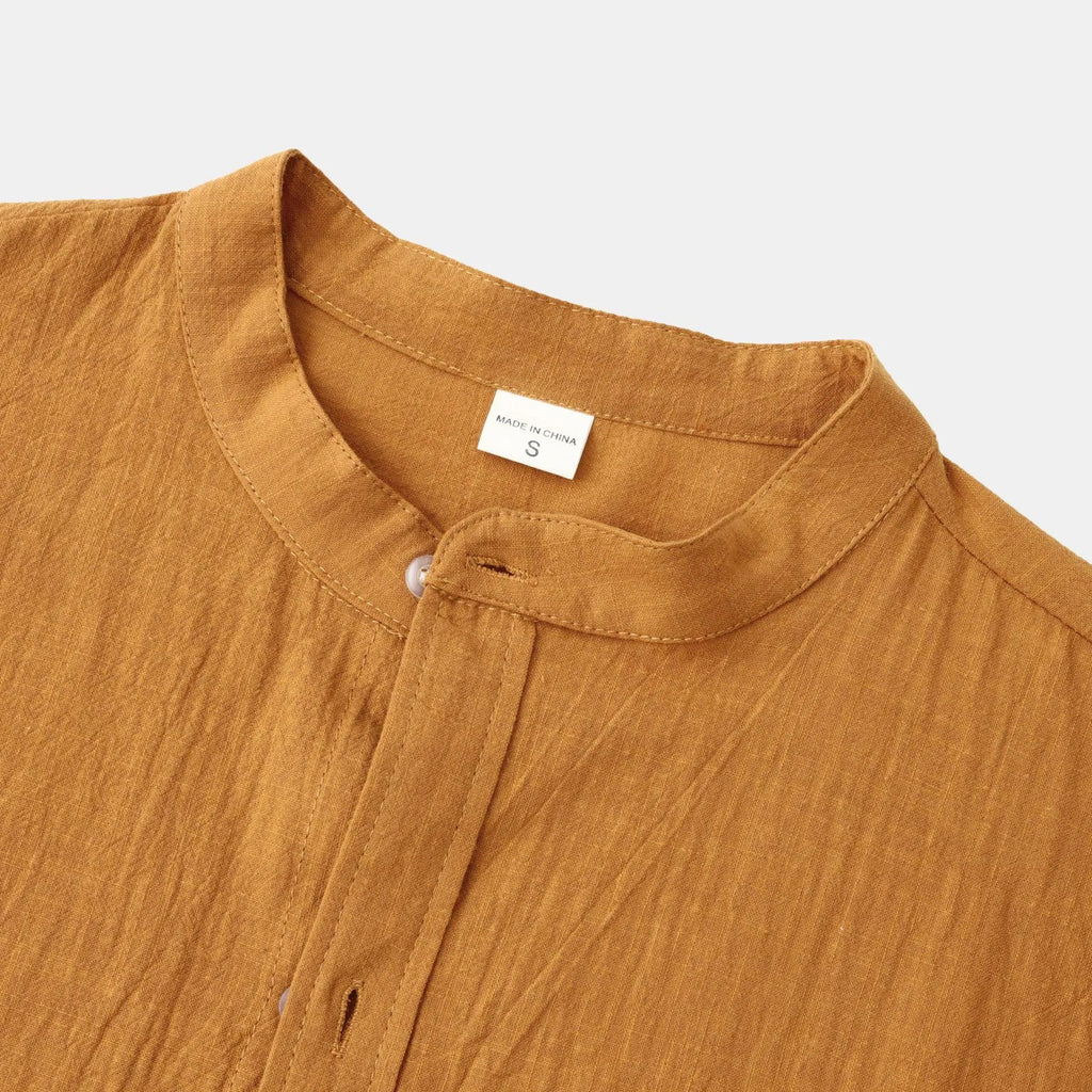 Brown men's slim fit long sleeve shirt and casual trousers set on a hanger.