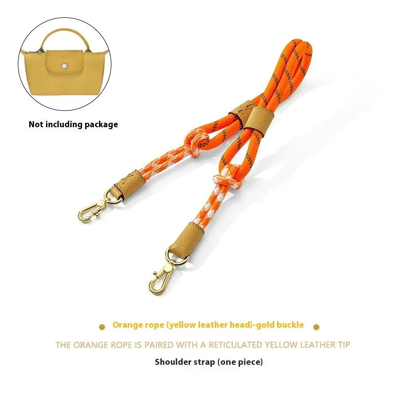 Braided nylon and cowhide leather crossbody shoulder strap with gold alloy buckle on a grey background.