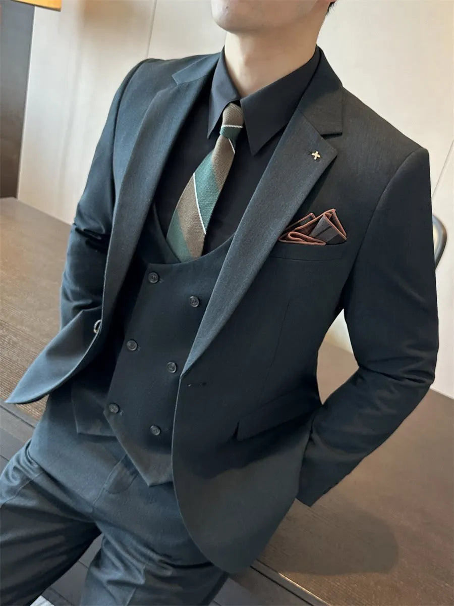 Men's slim fit business formal jacket and trousers in a dark green chemical fibre blend fabric.