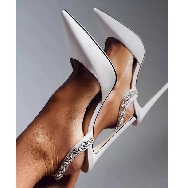 Pointed toe high heel sandals with rhinestone decoration on the side, in patent leather.