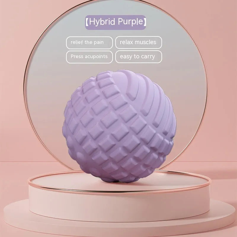 Blue peanut-shaped TPR foot massage ball on a wooden floor.