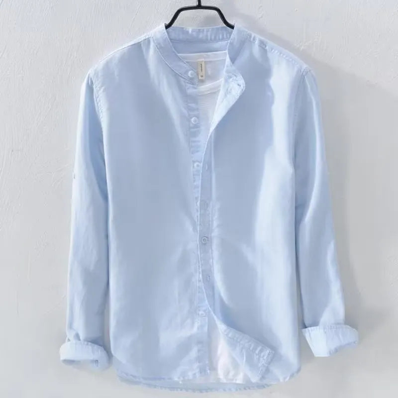 Loose fit long sleeve cotton linen shirt in solid dark blue colour displayed flat showing casual style