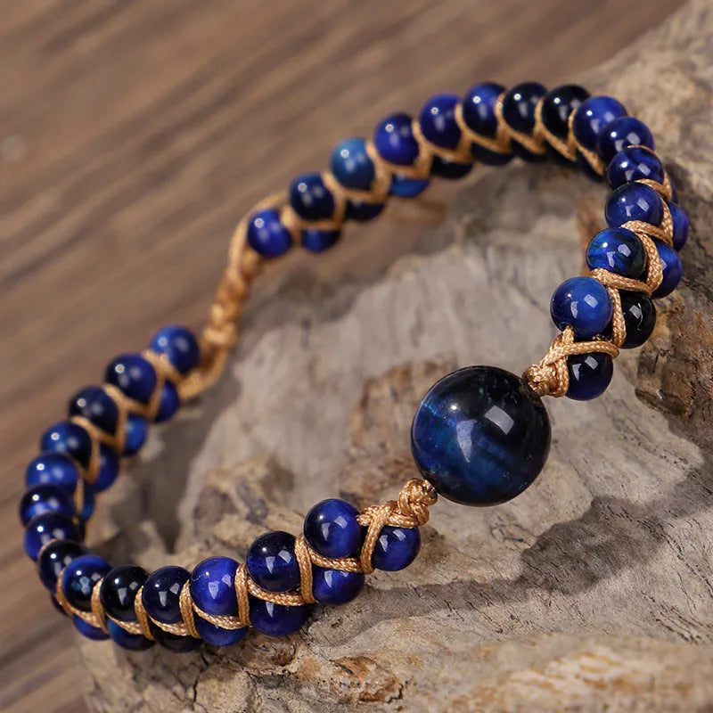 Handwoven geometric pull bracelet in blue tiger eye stone beads with adjustable closure