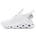 Children's black Velcro sneakers with fabric upper and textured EVA sole on a white background.