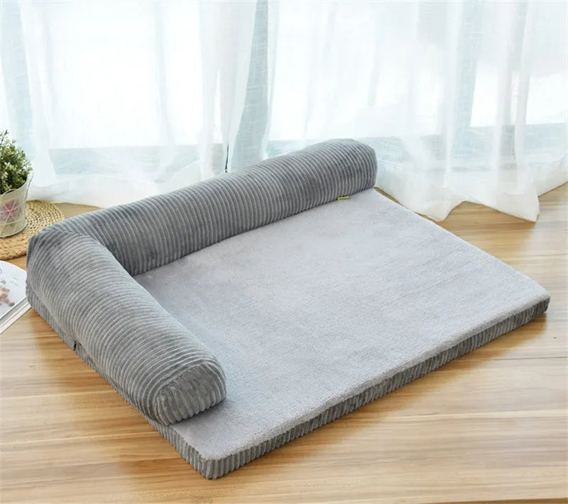 Corduroy pet dog bed sofa in a neutral colour with a raised edge and non-slip base.