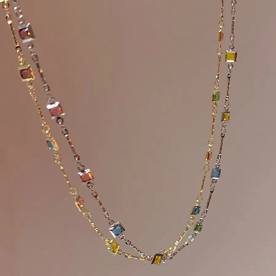 Square colour clavicle chain necklace with geometric quadrilateral links and artificial crystal detailing in gold finish