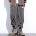 Men's grey ankle strap sweatpants with straight leg cut on mannequin