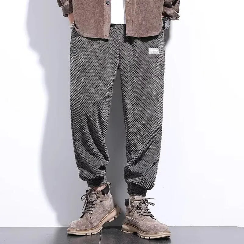 Men's grey ankle strap sweatpants with straight leg cut on mannequin