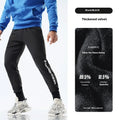 Men's black air layer ankle-tied sweatpants with mid waist design shown laid flat