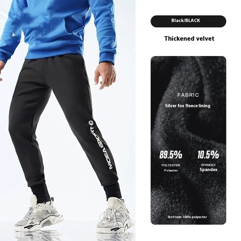 Men's black air layer ankle-tied sweatpants with mid waist design shown laid flat