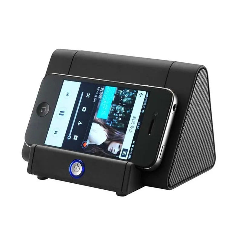 Black and white mini wireless Bluetooth speaker for mobile phones and computers.
