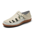 Blue plus size women's flat sandals with hollow-out design and toe cap on a thick rubber sole.
