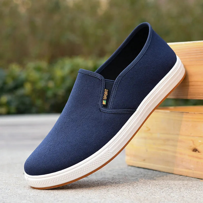 Men's low-top canvas slip-on shoes in BK Black colour with round toe design