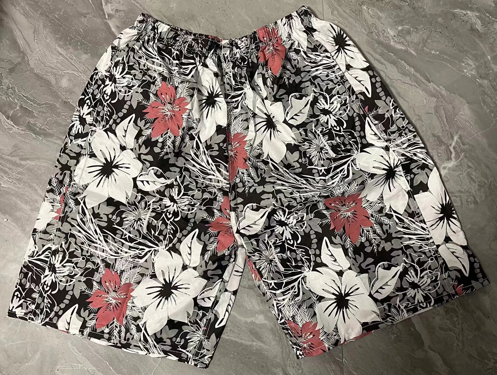 Men's floral printed five-point swimming trunks in free size made of polyester