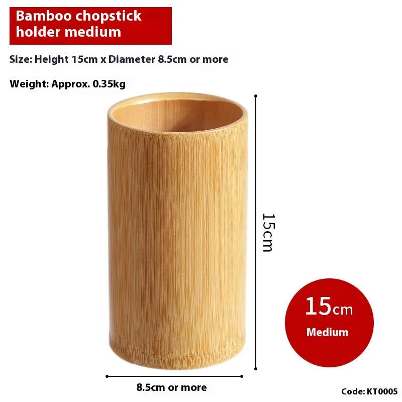 Wild bamboo chopsticks holder tube on a kitchen countertop.