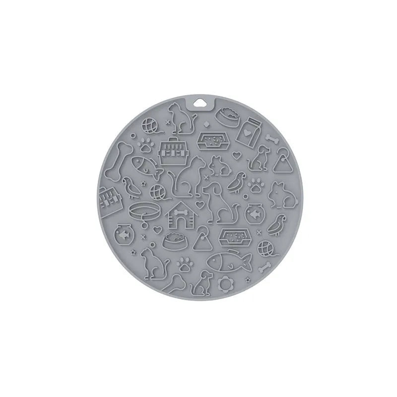 Round blue silicone pet lick mat with suction cup base on a kitchen counter