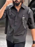 Men's black utility style button-up shirt with button front and regular fit