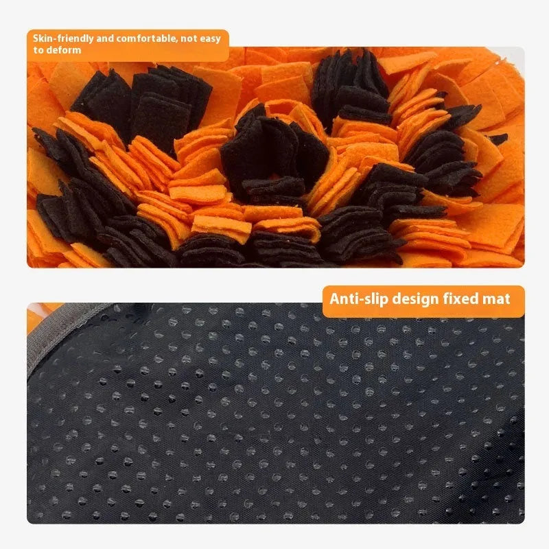 Orange pumpkin-shaped pet slow feeder mat on floor with scattered kibble
