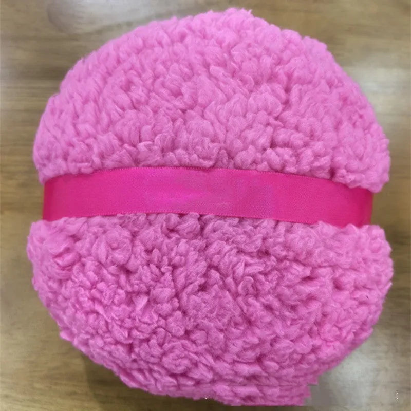 Oversized plush makeup powder puff in white, shown with dimensions 150mm by 75mm