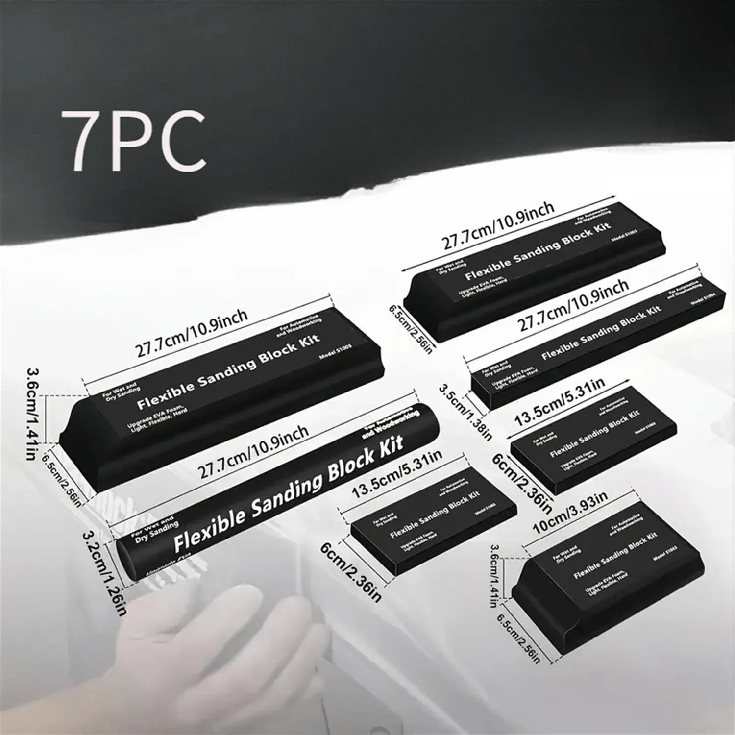 Seven black frosted EVA building blocks with metal connectors on a white surface.