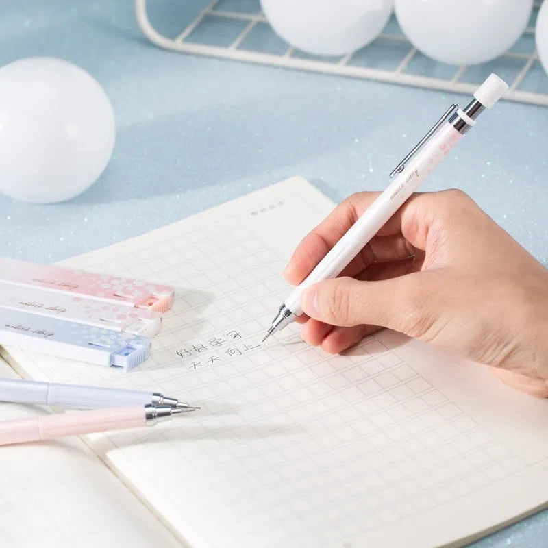 Three Sakura-design automatic pencils with mixed colours and 0.5mm HB refill boxes