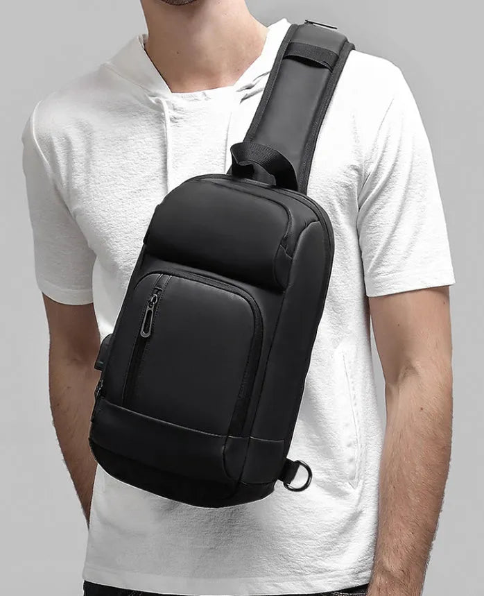 Black PVC outdoor shoulder bag with air cushion strap and multiple compartments