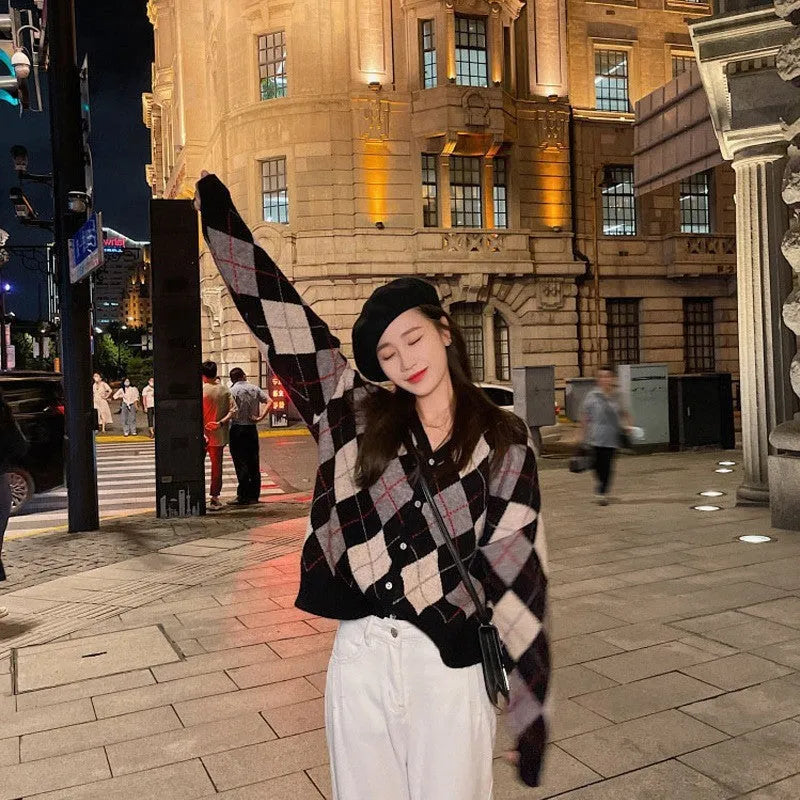 Casual pink knitted cardigan coat with regular sleeves, shown on a hanger.
