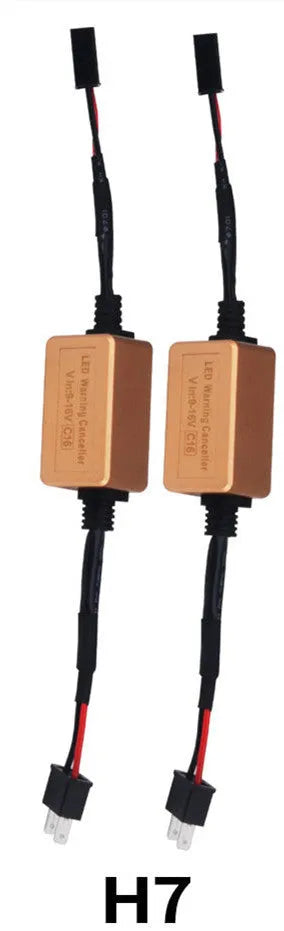 Black alloy LED Canbus decoder for H4 H7 H11 car headlight bulbs on a white background.
