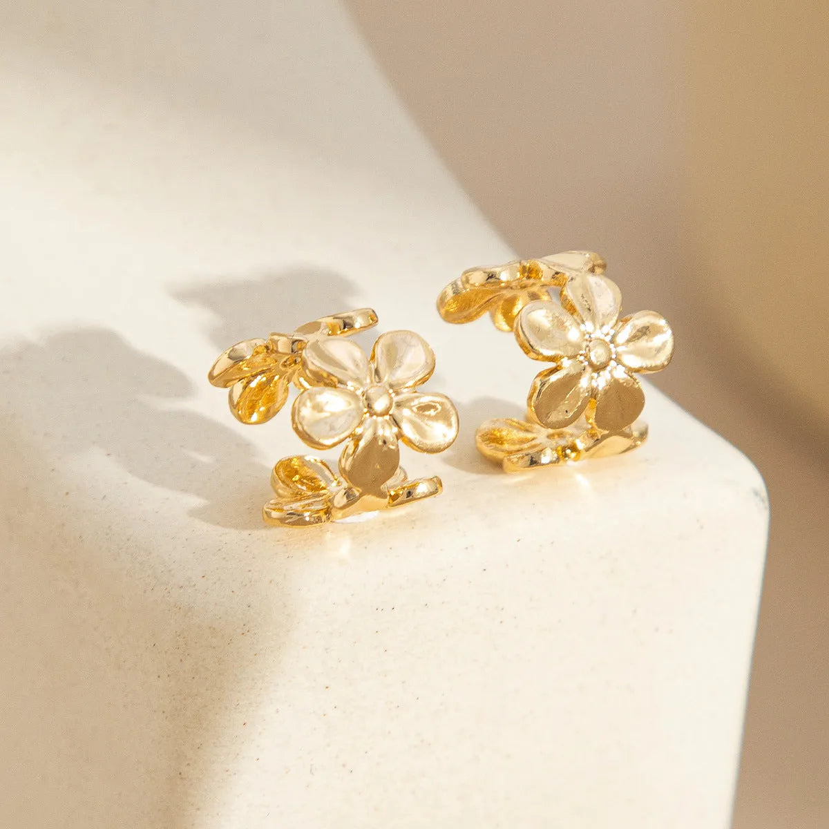 Gold starfish and conch design alloy earrings for women with electroplated finish