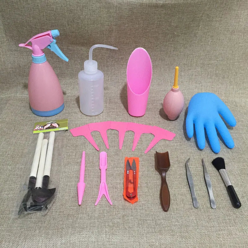 Succulent gardening tool set showing mini shovel, watering can, tweezers, and small scissors on a table.