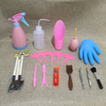 Succulent gardening tool set showing mini shovel, watering can, tweezers, and small scissors on a table.