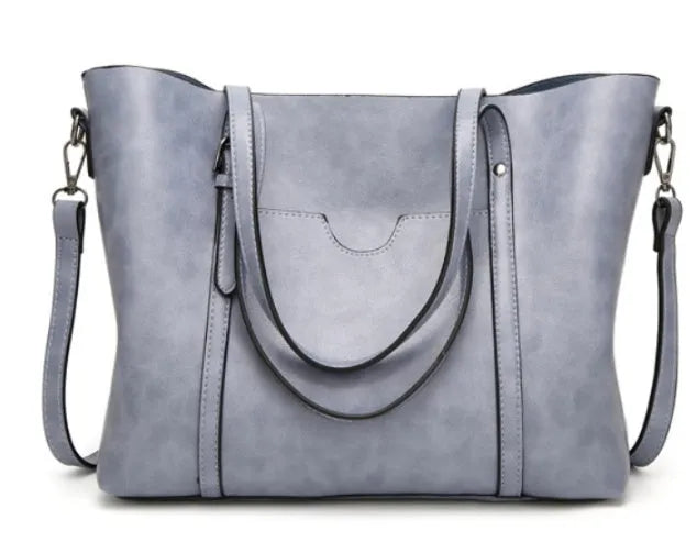 Retro messenger bag for women showing coffee colour option with A4 magazine for scale