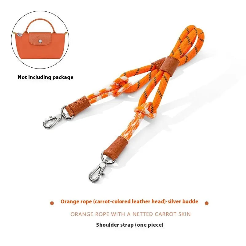 Braided nylon and cowhide leather crossbody shoulder strap with gold alloy buckle on a grey background.