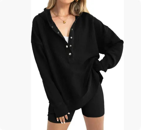 Women's loose fit raglan sleeve sweater in peacock green, shown on a model.