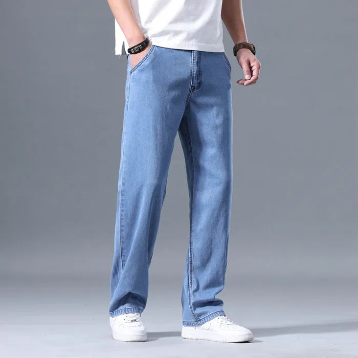Men's loose straight-leg lyocell jeans in blue and grey colour options with zipper fly
