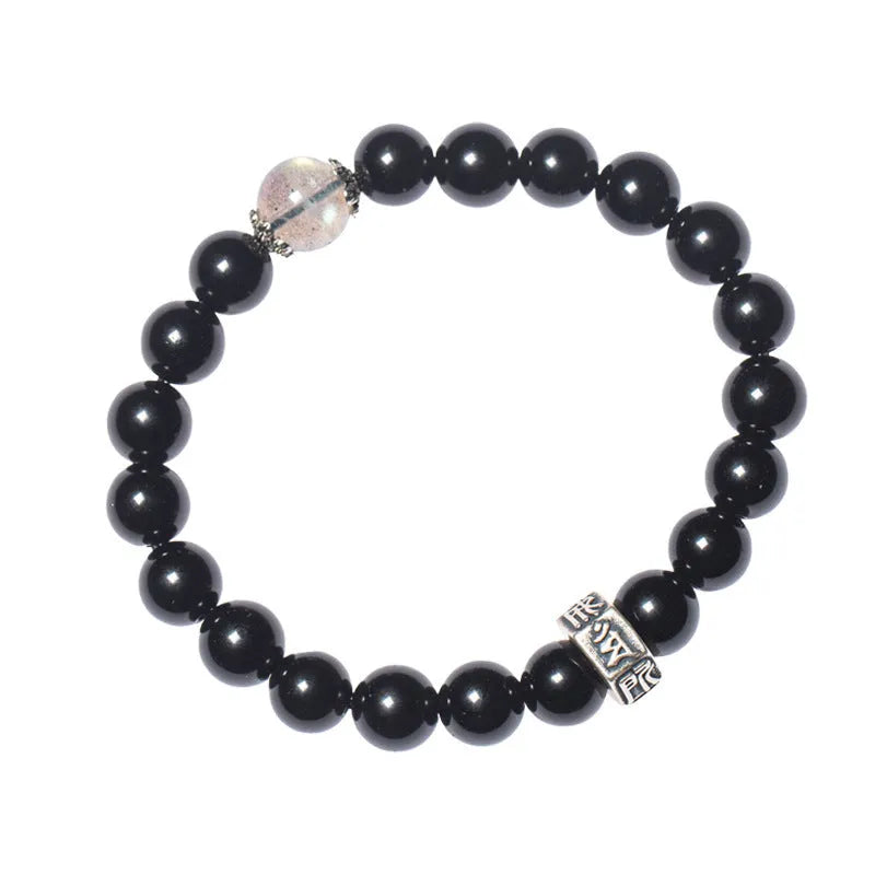 Dark 8mm obsidian bracelet with carved Chinese zodiac animal design on a wrist.