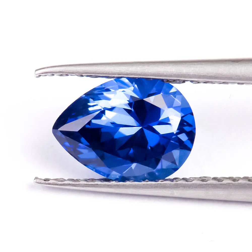 Royal blue love shaped tiara gemstones in various weights and shapes including heart, round, and pear styles