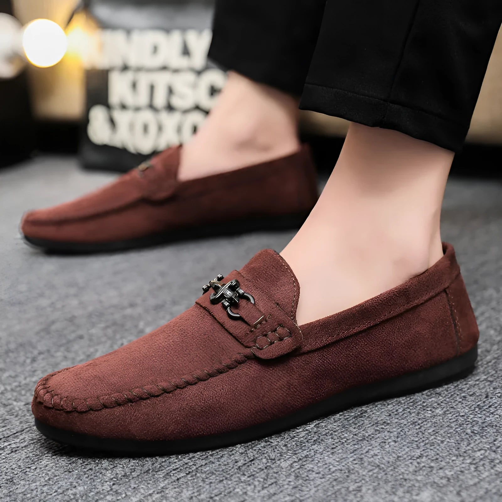 Men's waterproof black slip-on loafers with round toe and low stiletto heel on a rubber sole.