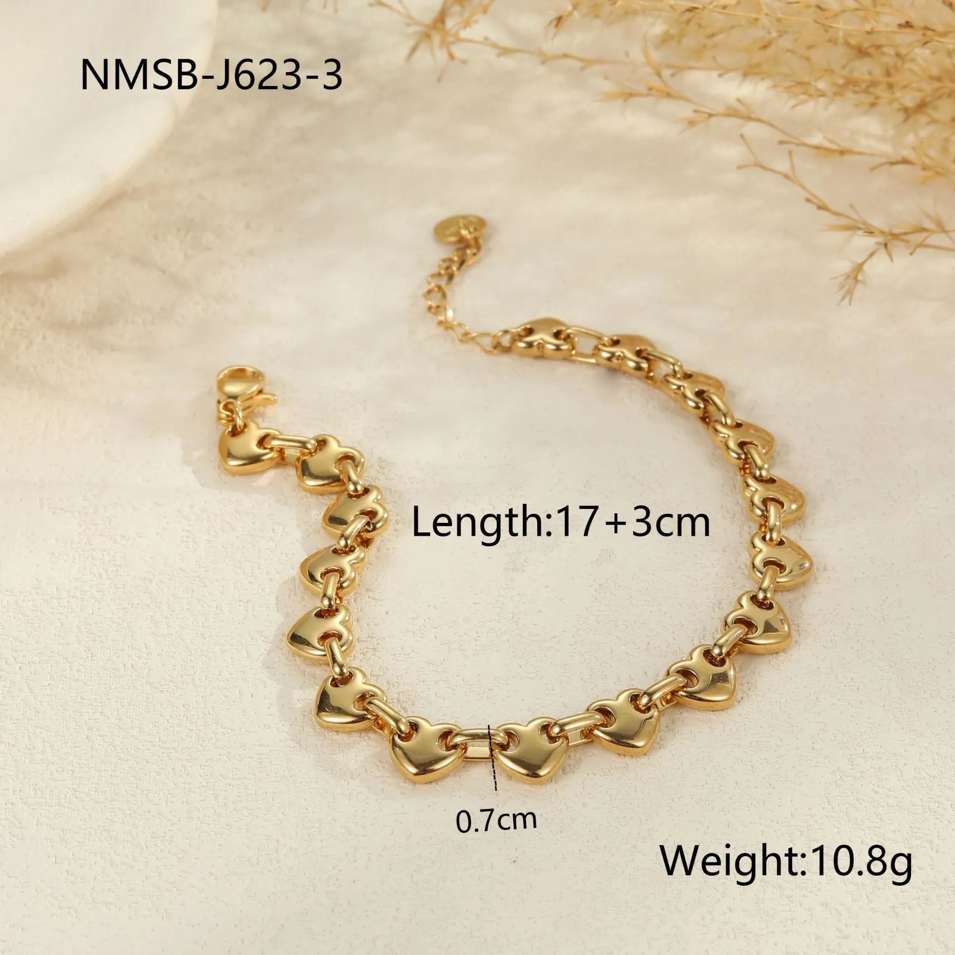 Hollowed-out heart bracelet in stainless steel with 18K gold plating showing simple geometric design