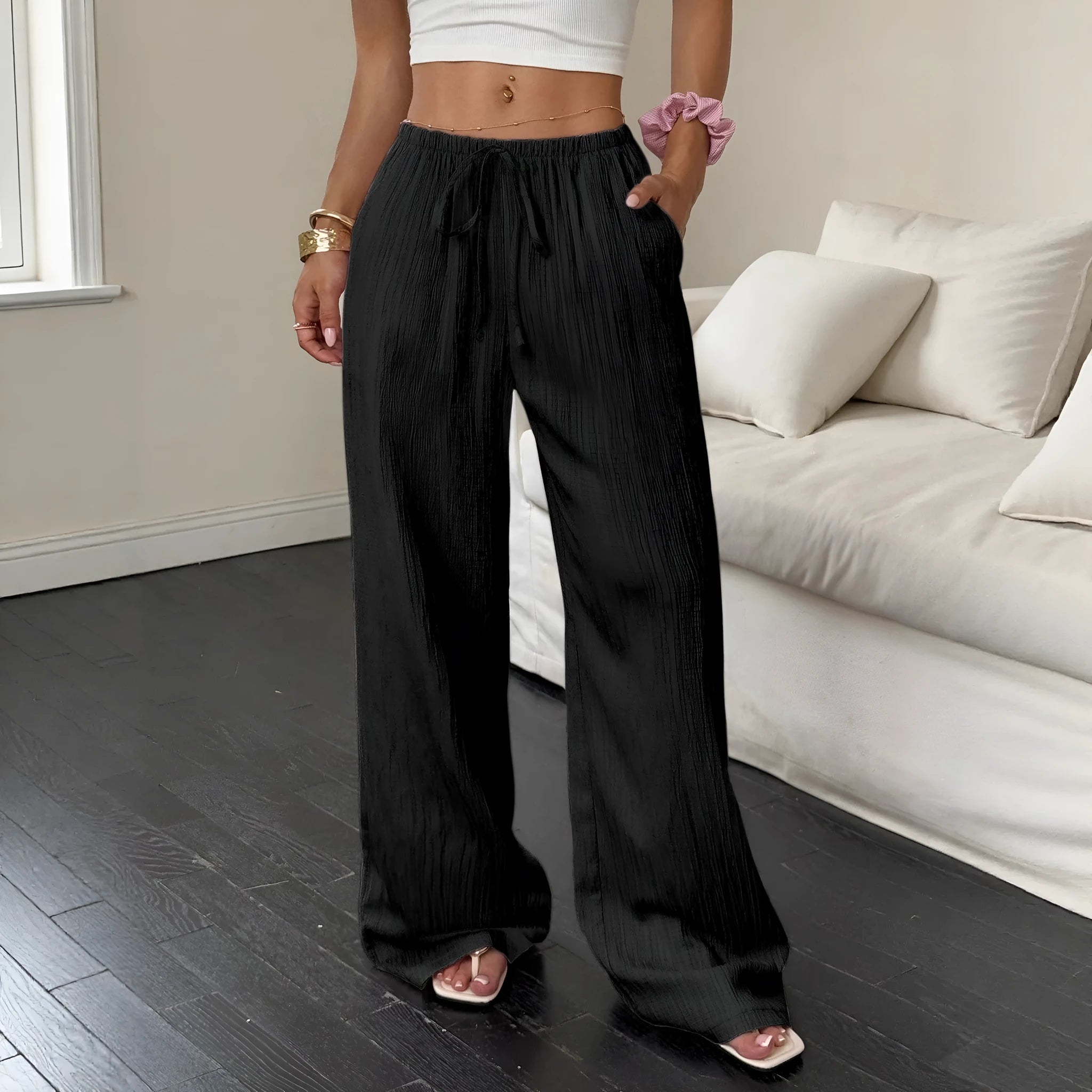 Women's wide-leg trousers with lace-up waist detail in black and pink colour options