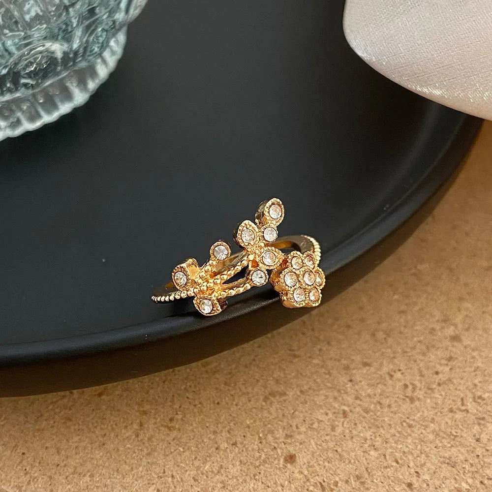 Women's copper open ring with diamond flower and leaf design in gold or white finish